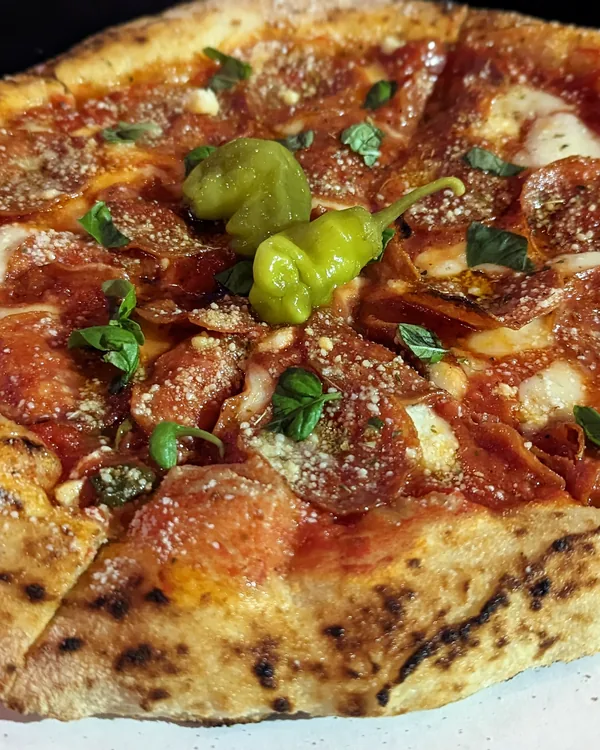 Pepperoni pizza with cherry peppers