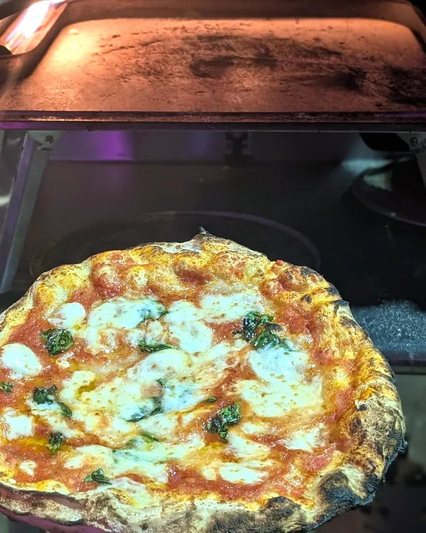 Pizza in the wood-fired oven
