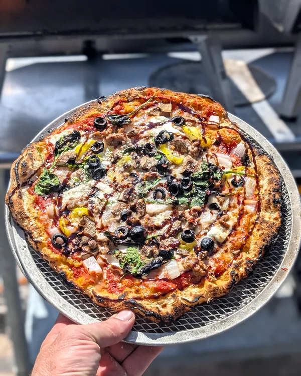 Supreme pizza by the oven